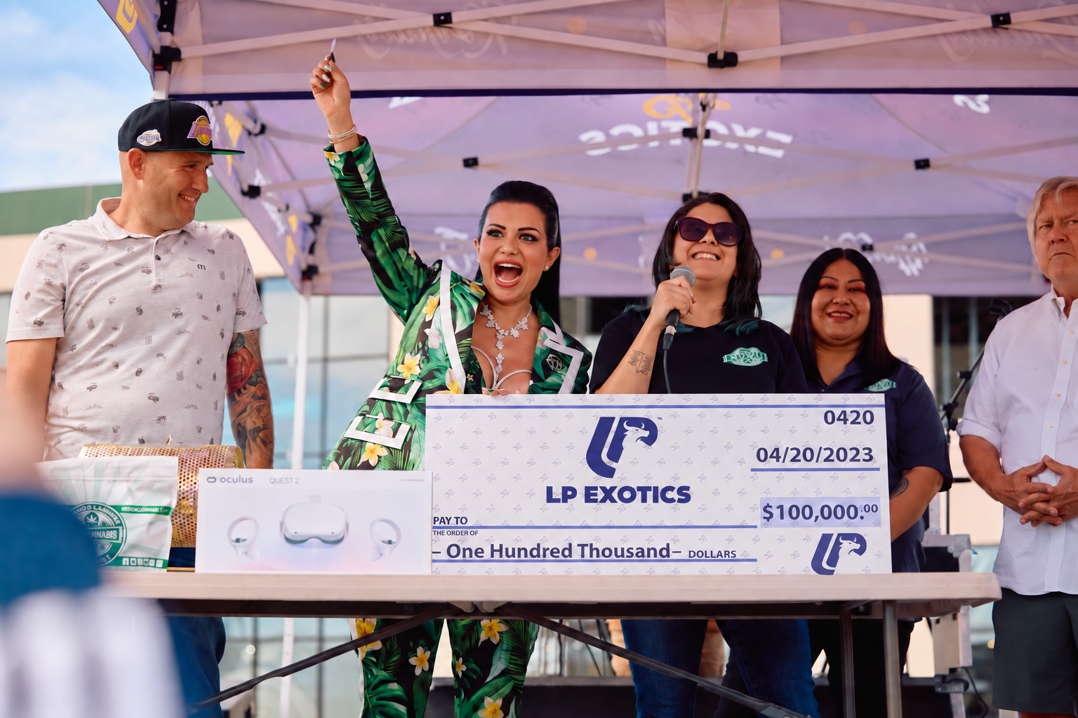 LP and NuWu giveaway moment with attendees gathered behind a large LP Exotics check